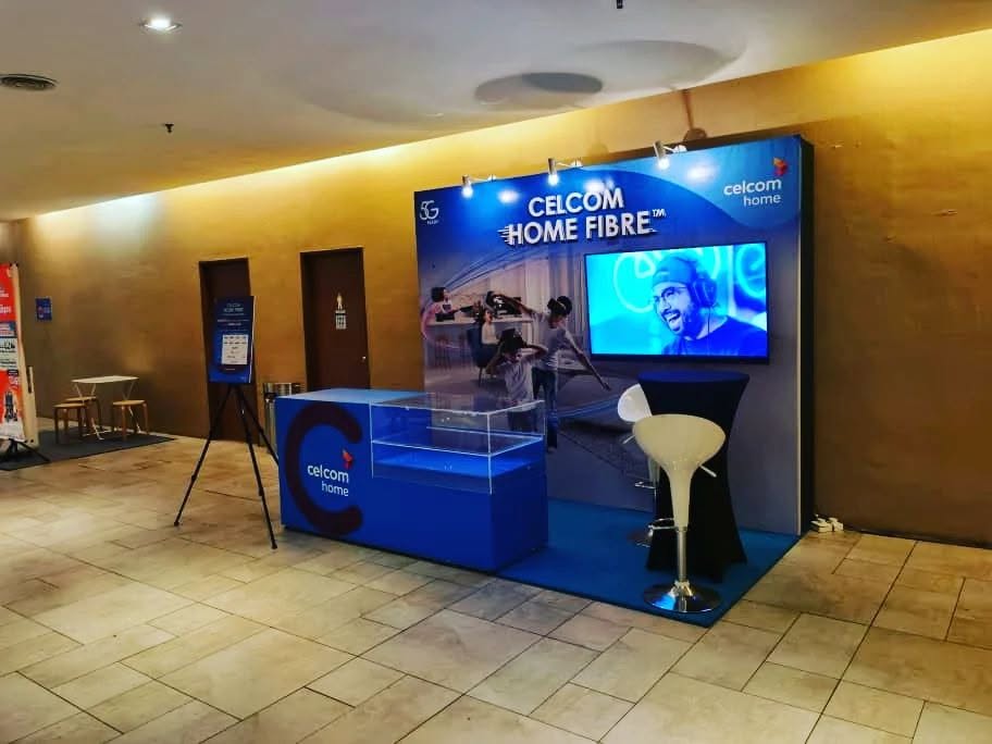 Celcom Home Fibre branded activation booth in a mall lobby